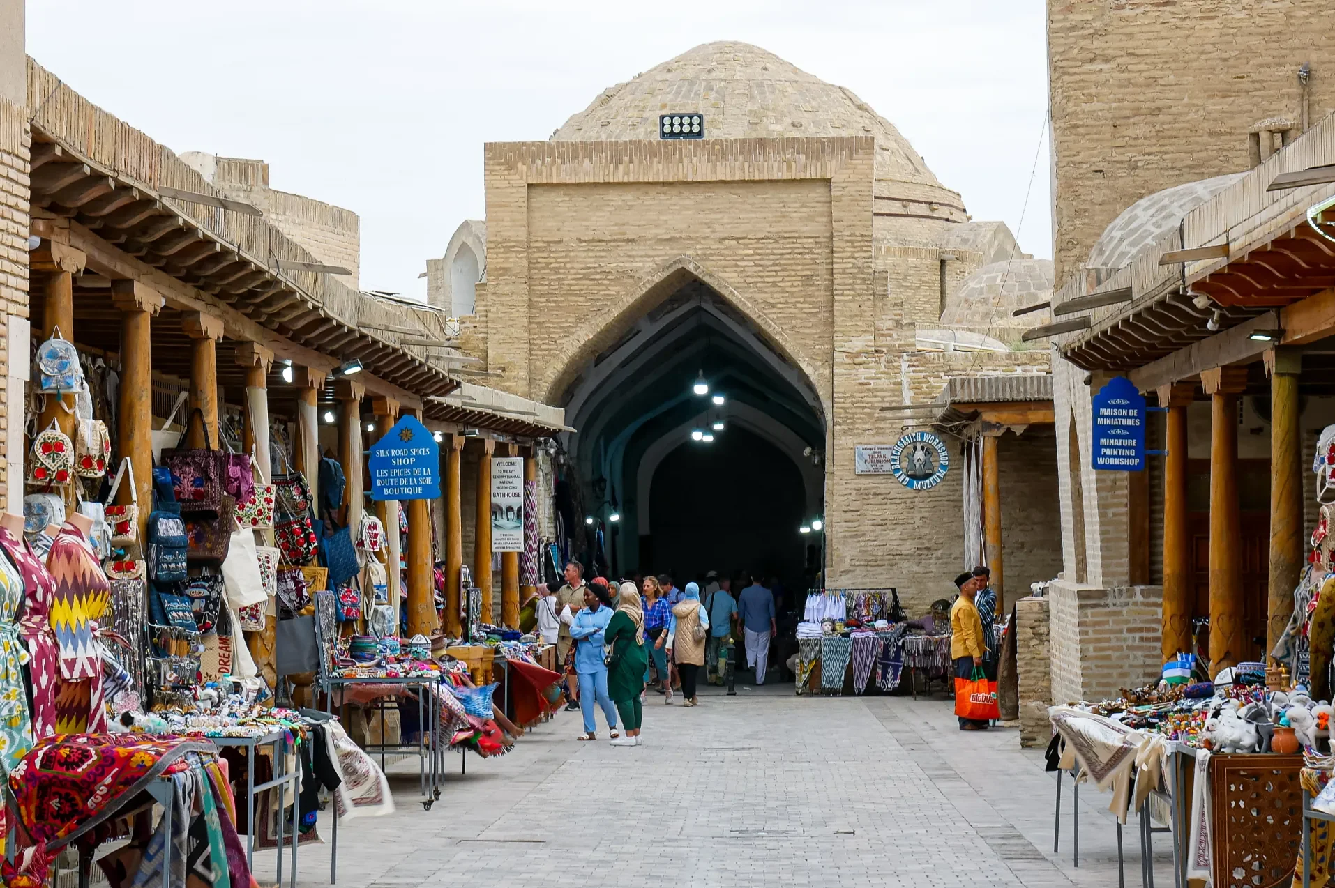 souvenir vendors in bukhara uzbekistan with one of the citys trading domes in the background. david andreas al jazeera 1688616446